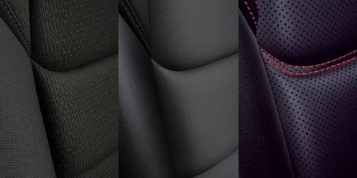 新型CX-5のシート表皮のアップ。左から、織物調の黒、なめらかな黒、赤い縫い目の入った穴あきの黒